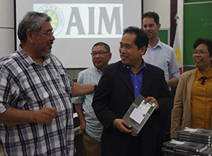 Undersecretary Gerundio C. Madueño of the Department of Agrarian Reform, Philippines receives his copy of the book