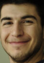 A close up of Samir smiling