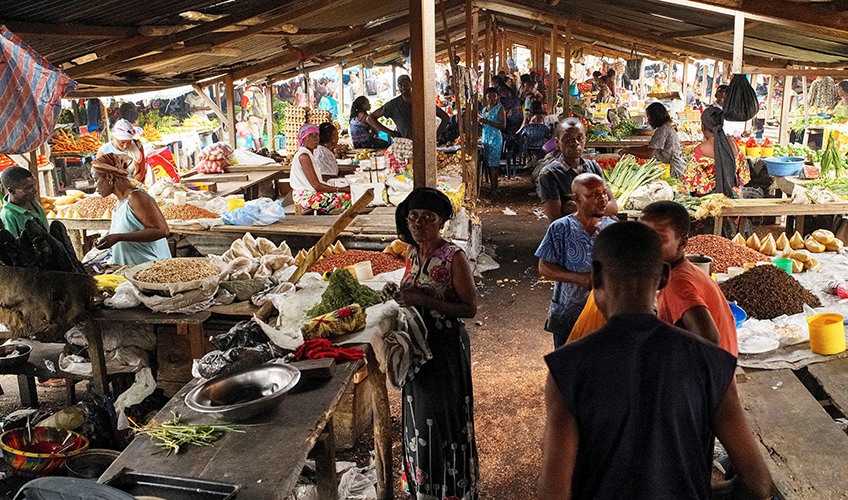 Small-scale traders selling their products at in a market in DRC.