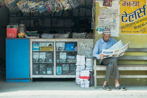 Man reading a newspaper. Right to voice project Nepal. Photo by Robic Upadhayay