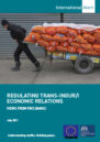 Front cover showing a man pulling a trolley full of sacks.