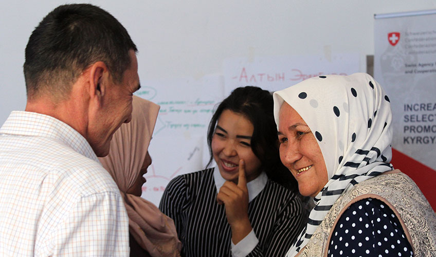 Young women and men take part in an interactive game.