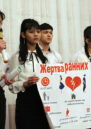 Students making a presentation about the need to prevent early marriages