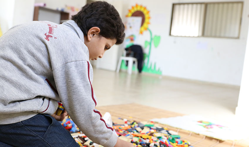 A boy plays at the Peace Education project in Shatila refugee camp in Lebanon