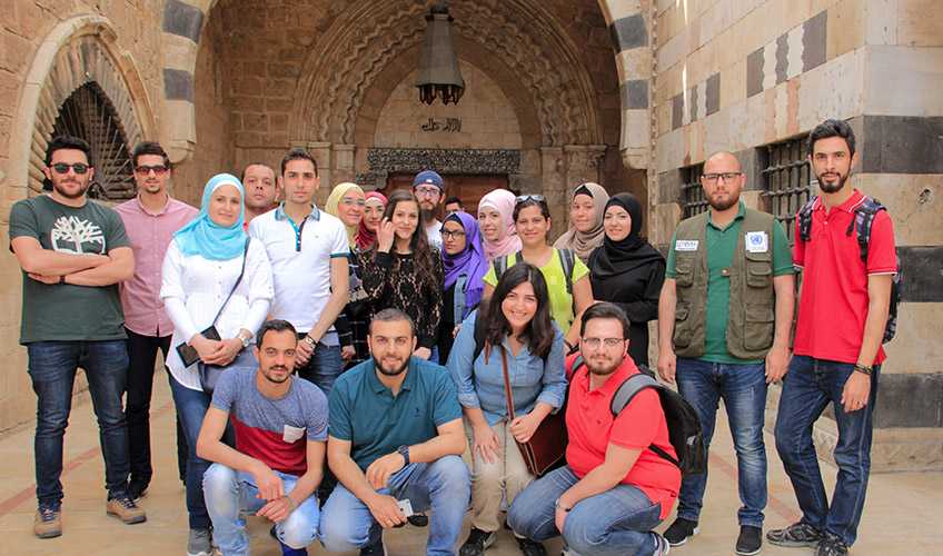 A group of volunteers sit together in Tripoli.