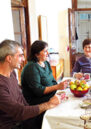 Aida and others sat around the dining table
