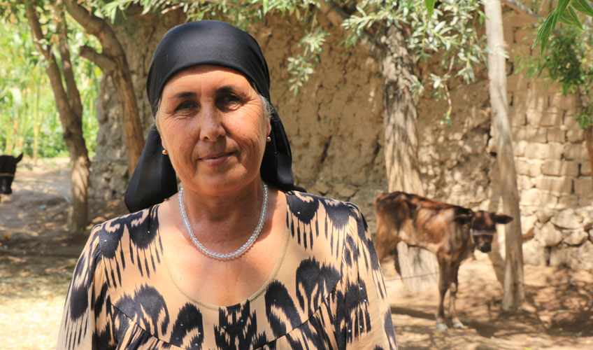 Close up of a woman in a black headscarf.