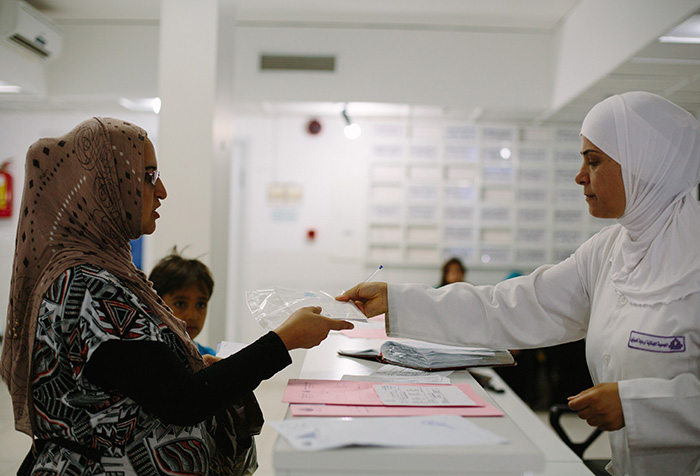 People in a health centre waiting room in Lebanon