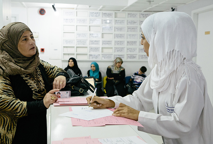 People in a health centre waiting room in Lebanon