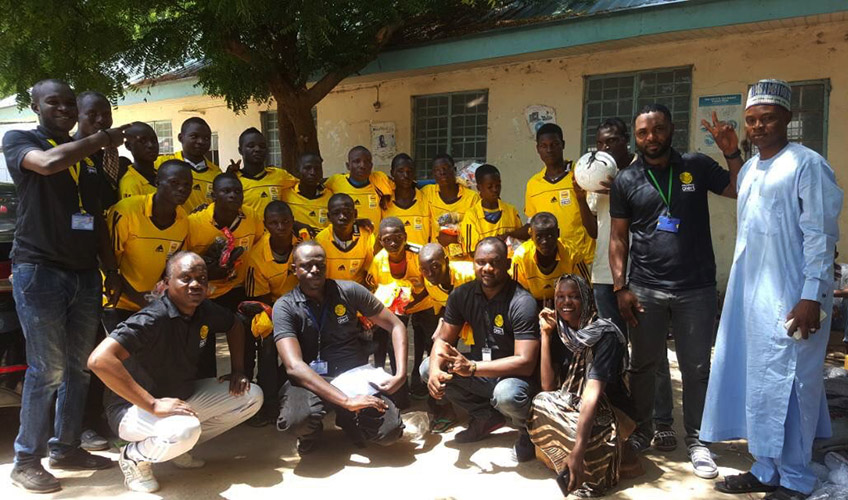 Players pose as a group at the Peace Day sports tournament, 21 May 2017