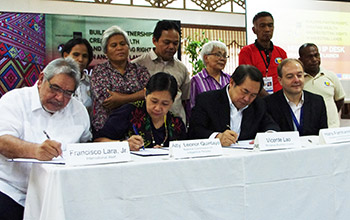 Signing of the memorandum of agreement among representatives of International Alert, MinBC and NCIP during the Mindanao IP Desk launch.