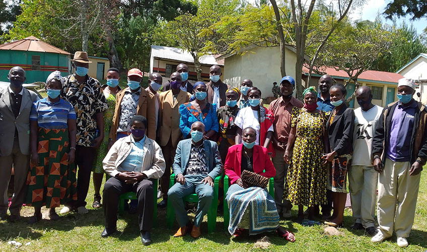 Members of the Kuria East District Peace Committee pose for group photo after one of the monthly DPC and community engagement forum at Kegonga Deputy County Commissioner’s office in Kuria East Sub-County.