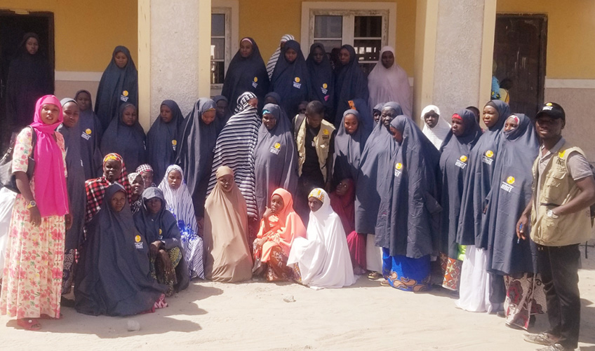 Women participants in the Zaman Lafiya Hakin Mu (Peace is our obligation) project pose for the camera.