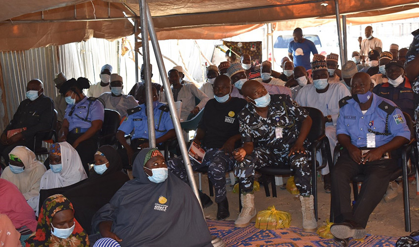 Women taking part in a community security partnership (CSP) meeting with police, military and other security groups.