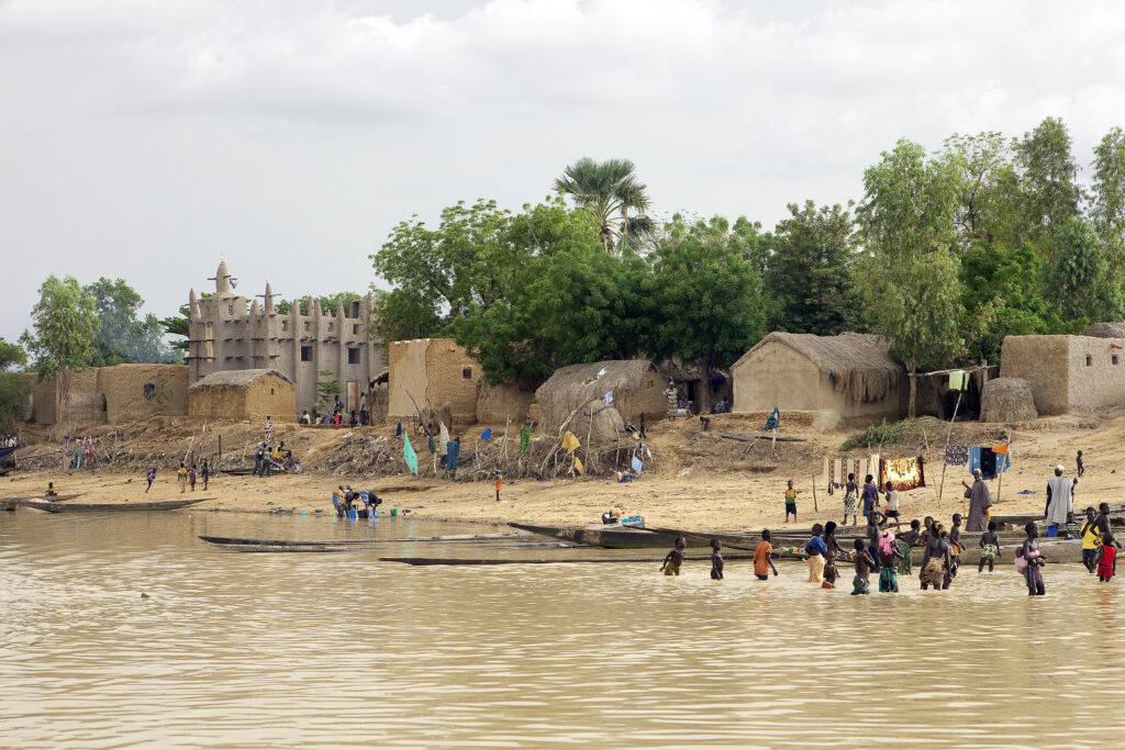Members of a Bozo ethnic village in Mali gather on the banks of the River Niger