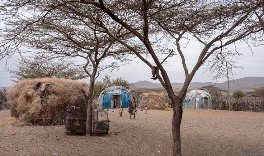 A mother and her children at their Manyata homestead.