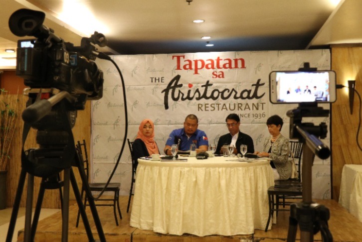 Jalilah Sapiin (leftmost) sits with fellow MRCW members Saripada Pacasum, Jr. (middle left) and Fedelinda Tawagon (rightmost) and Task Force Bangon Marawi Field Office Manager Felix Castro (middle right) during a media briefing on the status of the Marawi rehabilitation on 18 November 2019. 