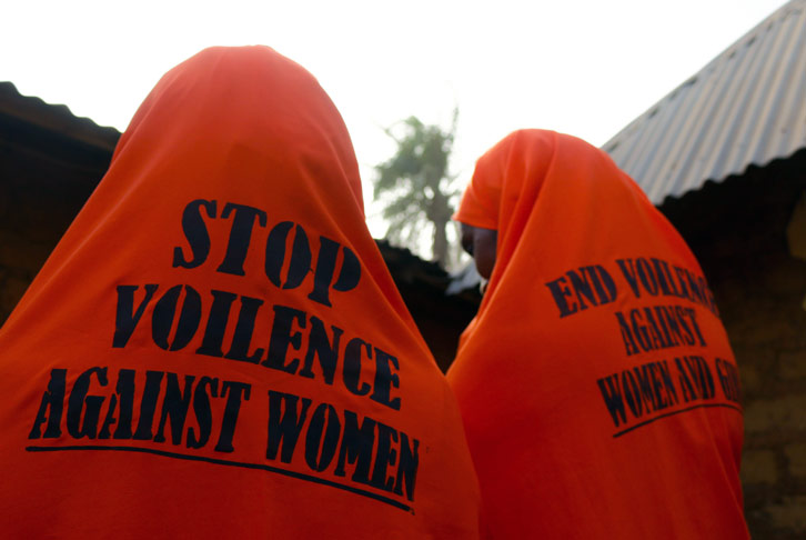 Hadiza and Hauwa's matching hijabs which say 'Stop violence against women and girls'