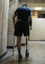 A Ukraine veteran walks down a corridor.