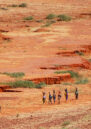 People walking through the landscape of the Sahel.