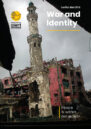 Front cover showing a burnt-out building.