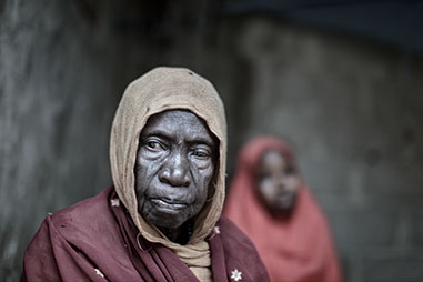 Woman in Nigeria looks to camera. Photo by Carol Allen Storey Bad Blood project