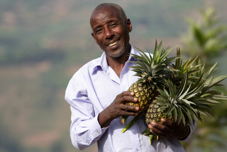 Alexis poses with pineapples