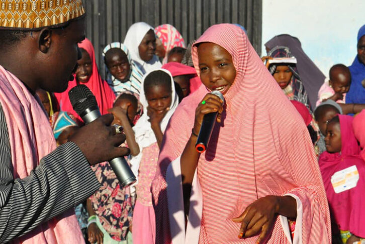 Man and women presenting a radio show live