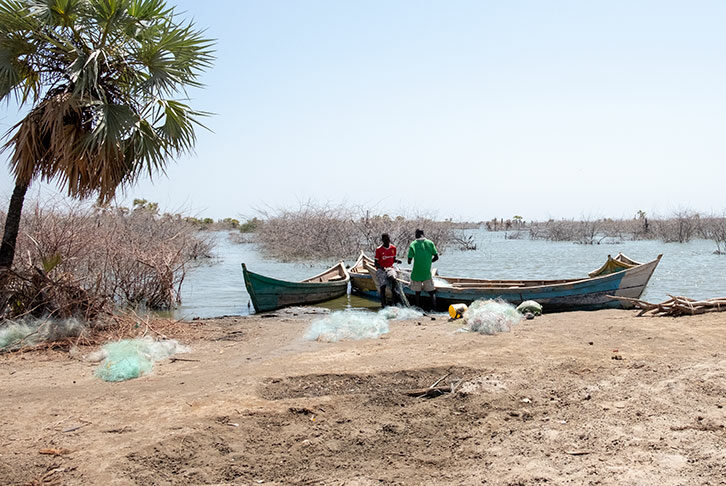 Fishermen preparing their nets before going out to fish in Imprsa Beach Kalkol Town Kenya