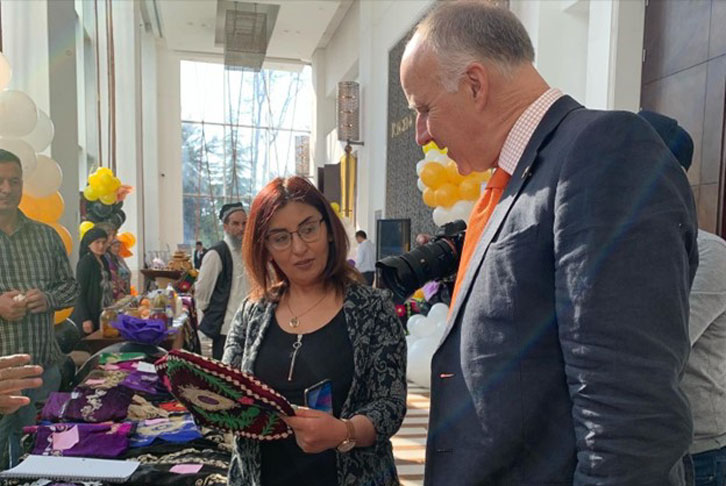 Living with Dignity Project Manager, Ms Zubayda with British Ambassador Tim Jones at International Alert International Women's Day event in Tajikistan